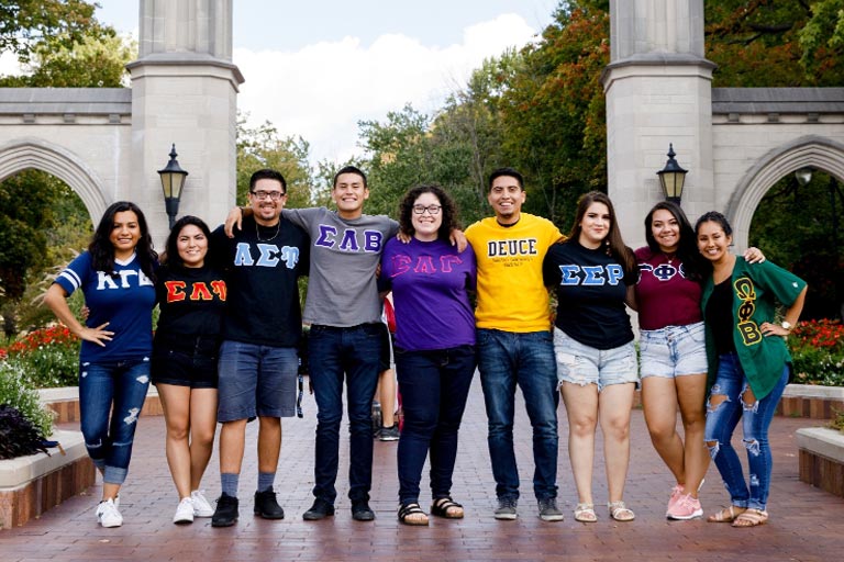 members of the multi-greek council standing in front of the sample gates